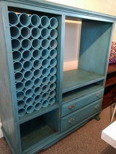 a blue bookcase with lots of bottles on it