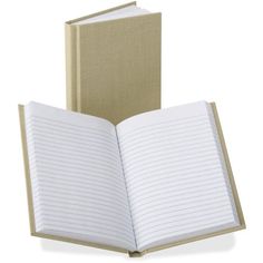 an open notebook sitting on top of a white table next to a book with lined pages