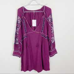 Brand New With Tags. All My Life Mini Dress. Tie Tassel Closure. Pockets. Excellent Condition! Size: Small Approximate Measurements: Shoulder To Hem 34”. Pit To Pit 19.5”. 746 Purple V-neck Dress With Floral Embroidery, Casual Boho Dress With Floral Embroidery V-neck, Free People Boho Dress, Long Sleeve Embroidered Dress, Boho Tunic Dress, Embroidered Dress Boho, Macrame Dress, Midi Wrap Dress, Boho Tunics