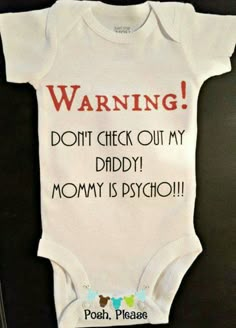 a baby's bodysuit that says warning don't check out my daddy mommy is