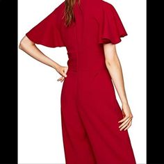 Zara Red Flowing Jumpsuit With Bow Ruffled Sleeves Jumpsuit With V Neck. Short Sleeves With Ruffle Appliqu. Wide Leg. Back Hidden In-Seam Zip Closure. New With Tag Approximate Measurement Laying Flat Pit To Pit 18” Waist 16” Length 52” Composition 96% Polyester 4% Elastane Elegant Zara Jumpsuits And Rompers, Red Summer Formal Jumpsuits, Red Summer Workwear Pantsuit, Elegant Red Jumpsuits And Rompers For Spring, Elegant Red Summer Pantsuit, Elegant Red Jumpsuits And Rompers For Work, Chic Red Short Sleeve Jumpsuits And Rompers, Red Chic Jumpsuits And Rompers With Ruffles, Elegant Red Jumpsuit For Workwear