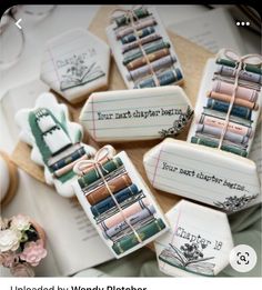 some cookies decorated like books are sitting on a table