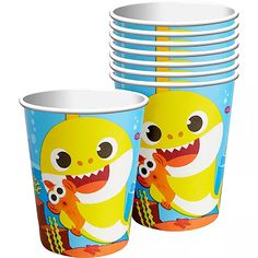 there are many cups with different designs on them