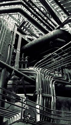 black and white photograph of pipes in an industrial facility