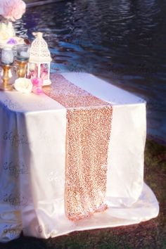 the table is covered with pink and gold sequins