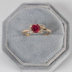 "Minimalist Ruby Diamond Engagement Ring,Natural Ruby Gemstone,Cluster Diamond Ring,Minimalist Ring,Promise Gift,Red Stone Proposal Ring,MOM ★ ★ ★ ★  CUSTOM/DUTY-FREE SHIPPING WORLDWIDE, BUYERS DON'T HAVE TO PAY ANY CUSTOM FEES WHILE IMPORTING ★ ★ ★ ★  Details Made to order Material: 14k/18k Gold Color Options: Yellow Gold, White Gold, Rose Gold ★ Center Stone Ruby, Round Size: 6 mm  Approx Weight (Ct): 0.585 ★ Accent Stones Diamond/Moissanite Round Size: 2mm * 8 Nos Approx Weight (Ct): 0.24 ★ 100% Natural Diamond and Gemstones ★ Diamond: Round Brilliant cut, G-H Color, SI Clarity ☂ Shipped with Insured Shipping within 4-7 business days. ➦ 100% Free Returns. ➦ Our Jewelry comes with a Lifetime Warranty. (Stone Replacement not included) ✈ We offer free EXPRESS shipping across the world. ★ W Ruby Diamond Engagement Ring, 14k Gold Ruby Ring, Cluster Diamond Ring, Ruby Ring Gold, Pink Tourmaline Ring, Ruby Diamond Rings, Handmade Fine Jewelry, Natural Gemstone Jewelry, 18k Gold Ring