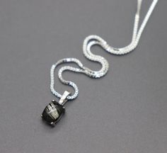 "This mourning jewelry keepsake necklace is made from 925 sterling silver. The dainty pendant measures 14mm tall and 6mm across and hangs from a sterling box chain. Your preferred length of chain can be chosen from the drop-down menu. A handmade domed \"stone\" is carefully created around your lock of hair or animal fur. I layer and shape my handmade stones methodically for maximum magnification of the hair provided. We have a wide assortment of colors that can be chosen for the background, view Sterling Silver White Gold Necklace For Memorial, Adjustable Sterling Silver Memorial Jewelry, Minimalist Sterling Silver Memorial Necklace, Silver Square Pendant Jewelry For Memorial, Minimalist White Gold Jewelry For Memorial, Elegant Adjustable Memorial Necklaces, Elegant Adjustable Necklace For Memorial, Elegant Sterling Silver Jewelry For Memorial, Hair Pendant