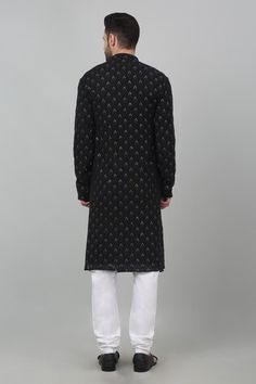 Black cotton kurta with all over floral checkered pattern, metallic sequin and tonal thread embroidery. Paired with contrast gathered churidar. - Aza Fashions Designer Black Cotton Sherwani, Eid Designer Wear Kurta With Woven Motifs, Designer Cotton Traditional Wear For Festive Occasions, Black Cotton Sets With Mirror Work, Black Cotton Sherwani For Festive Occasions, Festive Black Cotton Sherwani, Fitted Kurta With Woven Motifs For Transitional Season, Festive Straight Kurta With Woven Motifs, Black Straight Kurta For Winter