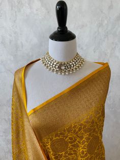 ShopNaya brings you exquisite handloom Banarsi pure silk collection from Varanasi, India. Banarsi is a labor of love, a luxury statement. It's a heavier saree with rich bold colors, hours of labor put together to make one fine saree. The weave, the craftsmanship is one of the finest in the world. Banarasi Katan Silk Saree in yellow. Body of the saree has beautiful rose motifs in antique zari. Pallu has solid band of antique zari with intricate geometric pattern. Color of the blouse is yellow wit Yellow Banarasi Saree Bridal, Yellow Banarasi Saree, Saree Yellow, Engagement Jewellery, Banarasi Katan Silk Saree, Banaras Sarees, Haldi Outfits, Banarsi Saree, Saree Jewellery