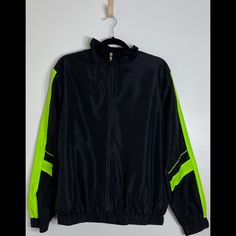 Super Cute Windbreaker, Kinda Has An Oversized Fit. Brand New With Tags Never Worn And Has No Flaws. Bright Neon Green Contrast Design Along Sleeves. Can Fit Sm-Med. Black Track Jacket With Contrast Panels For Fall, Sporty Black Color Block Outerwear, Sports Green Color Block Outerwear, Green Color Block Outerwear For Sports, Black Long Sleeve Track Jacket With Contrast Panels, Black Casual Track Jacket With Contrast Color, Casual Black Track Jacket With Contrast Color, Black Windbreaker With Contrast Color For Fall, Black Track Jacket With Contrast Color