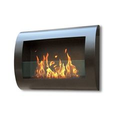 a fire burning inside of a black wall mounted fireplace