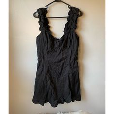 Free People Nwt Black Ruffle Button Down Sleeveless Mini Dress, Size Large, Minor Flaw With One Of The Buttons See Photo, Otherwise New Condition Black Summer Sleeveless Dress With Ruffles, Black Sleeveless Mini Dress With Buttons, Black Sleeveless Summer Dress With Ruffles, Black Sleeveless Ruffled Summer Dress, Fitted Black Sundress With Ruffles, Black Mini Dress With Ruffled Straps, Casual Black Sleeveless Dress With Buttons, Black Cotton Sleeveless Mini Dress, Black Sleeveless Button Dress For Summer