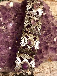 1940s Mexcian Sterling Silver Scroll Amethyst Cab Vintage Bracelet Vintage Silver Bracelets With Gemstones, Vintage Silver Gemstone Bracelets, Handmade Vintage Silver Cuff Bracelet, Handmade Vintage Amethyst Jewelry, Vintage Purple Bracelet For Formal Occasions, Vintage Purple Bracelets For Wedding, Vintage Purple Wedding Bracelets, Purple Vintage Jewelry With Intricate Design, Vintage Purple Jewelry With Intricate Design