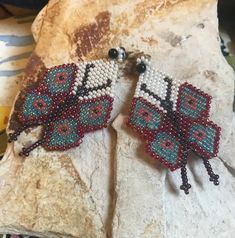 Sweet artisan made beaded butterfly earrings. The earrings have a 2-1/2 inch drop and are 1-3/8 inch wide. Handmade Multicolor Butterfly Earrings, Unique Handmade Butterfly Earrings, Bohemian Butterfly Shaped Beaded Jewelry, Bohemian Butterfly Beaded Jewelry, Handmade Butterfly Beaded Earrings For Gift, Beaded Butterfly Earrings, Earrings Native American, Beaded Butterfly, Earrings Patterns