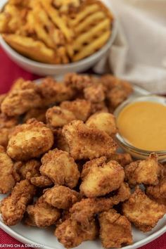 fried food on a plate with dipping sauce