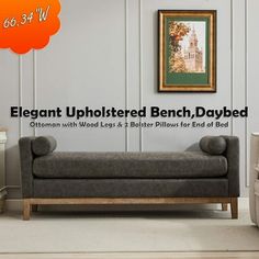 the elegant upholstered bench is displayed in front of a white wall with an orange cloud above it