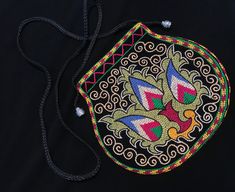 "Beautiful side bag handcrafted by members of the kuchi tribe. embroidery and well detailed in accordance to the kuchi member's taste.  A great piece for everyday wear! measurements: the purse is 7\" inches in length, 8\" inches in width the strap is 21\" inches" Traditional Pouch For Everyday Use And Festivals, Traditional Pouch For Festivals, Traditional Bags With Multicolor Embroidery And Handwork, Traditional Black Shoulder Bag As Gift, Traditional Black Shoulder Bag For Gift, Traditional Black Shoulder Bag Gift, Multicolor Handwork Pouch For Festivals, Traditional Shoulder Bag With Handwork Pouch, Handmade Bags For Festive Ceremonies