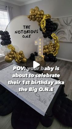 a baby is born to celebrate their first birthday with the big o'me balloon arch