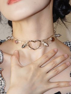 Embrace your Y2K millennial vibes with this edgy yet adorable punk studs heart choker. This choker features a leather subculture design, perfect for adding a touch of punk attitude to your outfit.   Please note that this product includes only the choker. Trendy Adjustable Choker For Valentine's Day, Trendy Choker For Valentine's Day Party, Trendy Party Choker For Valentine's Day, Trendy Valentine's Day Party Choker, Trendy Silver Choker For Concert, Edgy Choker For Alternative Fashion, Trendy Silver Choker For Alternative Fashion, Edgy Heart-shaped Choker For Concerts, Trendy Choker For Concert