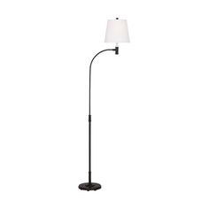 a black floor lamp with a white shade on the top and an iron pole base