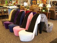 a bunch of different colored chairs in a store