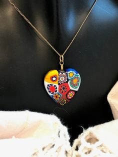 "This is a lovely unique, glass,Millefiori heart pendant and Brass chain. This necklace is in excellent, vintage condition. It is unique and rare. The necklace is 18 1/8 inches long. The pendant is 1 1/8 inches by 1\"." Vintage Multicolor Heart Beads Necklace, Heart-shaped Glass Necklaces For Jewelry Making, Vintage Murano Glass Necklace For Gift, Vintage Glass Necklace For Gifts, Vintage Glass Necklaces For Gift, Vintage Multicolor Jewelry For Valentine's Day, Glass Heart Beads Necklace As A Gift, Glass Necklaces With Heart Beads For Gifts, Yellow Gold Glass Necklaces As Gift