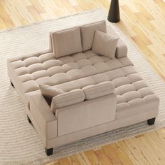 a couch sitting on top of a wooden floor