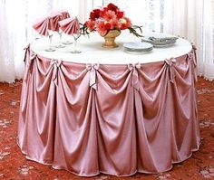 the table is covered with pink satin