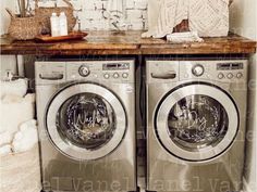 two washers sitting next to each other in a room