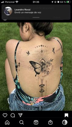 the back of a woman's body with butterflies on it