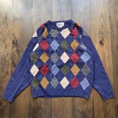 Vintage 1990s Wool Argyle Pattern Knit Sweater / size Large Pit to Pit:     24" Length:     27" Sleeve:     31" Please check the measurements before purchasing  -------------------------------- ⚠️ Please Note: All of our items are vintage. Please note that with vintage clothing, items may show some signs of wear. We do our best to include as much information about the items condition as possible. Please look carefully through the photos and feel free to reach out to us if you would like more inf Fitted Argyle Pattern Sweater For Fall, Fitted Argyle Sweater For Fall, Fitted Crew Neck Sweater 90s Style, Fitted Long Sleeve 90s Sweater, 90s Fitted Crew Neck Sweater, Fitted 90s Crew Neck Sweater, Vintage Argyle Sweater For Fall, Fall Season Argyle Sweater, Fall Fitted Argyle Sweater