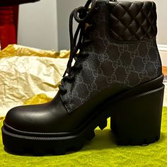 This Is An Authentic Pair Of Gucci Apollo Calfskin Gg Supreme Nappa Samoa Quilted Lace Up Ankle Boots Size 37 In Black. These Women's Boots Are Made Of Quilted Black Calfskin Leather And A Monogram Coated Canvas. These Boots Feature A Round Toe And A 3.5 Inch Heel. Condition: New With Tags, Unworn Size: 37 (7.5), 1 In Platform, 3 In Heel, 5 In Ankle Shaft Comes With: Shoes, Individual Dust Bags, Original Gucci Embossed Boxing Original Price: $1200 Before Tax Excellent Holiday, Birthday, Or Anniv Gucci Luxury Boots, Chic Black Gucci Boots, Gucci Black Round Toe Boots, Gucci Black Boots With Reinforced Heel, Gucci Black Ankle Boots, Gucci Black Luxury Boots, Designer Black High Heel Boots, Luxury Black Gucci Boots, Black Gucci Boots With Branded Heel