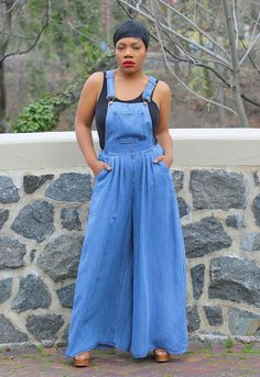 Wide Leg Overalls Get ready for warmer days in our fabulous denim wide leg overalls. Featuring a lightweight woven denim blend fabric shapes this jumpsuit. Buckled straps, front pocket, a fitted bodice, and a high and wide legs that have side seam pockets. Model is 5'5 wearing size M (8-10) Runs true to size. Sleeveless. Front pocket. Buckle closure. Side zipper. Side pockets. Wide Leg. Inseam approx. 32". 100% Tencel. Medium Wash Full Length Denim Jumpsuit For Spring, Full Length Medium Wash Denim Jumpsuit For Spring, Medium Wash Full-length Denim Jumpsuit For Spring, Summer Wide Leg Medium Wash Denim Jumpsuit, Chic Full-length Jumpsuits And Rompers With Pockets, Chic Denim Blue Jumpsuits And Rompers With Pockets, Dark Wash Wide Leg Overalls With Pockets, Casual Full Length Blue Overalls, Casual Blue Full-length Overalls