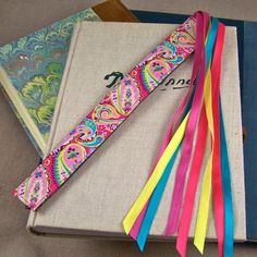 a book with ribbons on top of it