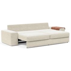 a white couch with a wooden arm rest on it's back end and the seat folded down