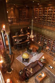 a living room filled with furniture and lots of wine bottles