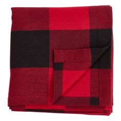 the red and black plaid blanket is folded