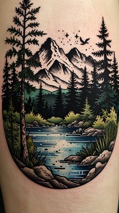 a woman's thigh with an image of mountains and trees in the water on it