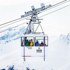 a ski lift with people on it in the snow