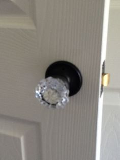 an open door with a glass knob on it