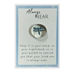 a blue and white card with a dragonfly on it's back saying, always wear