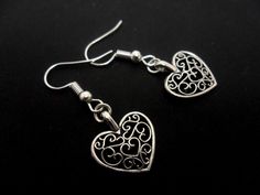 This is a pair of pretty little tibetan silver heart themed earrings. Measure approx. 3cm long. With silver plated hooks and findings. Thanks for looking!! Silver Double Heart Cute Earrings, Cute Double Heart Silver Earrings, Handmade Silver Heart Drop Earrings, Heart Themed, Gothic Accessories, Dangly Earrings, Ancient Greek, Silver Heart, Alex And Ani Charm Bracelet