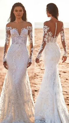 two women in wedding dresses standing on the beach with their backs turned to the camera