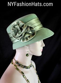 Dusty Lime Sage Green Winter Wool Designer Satin Rosette Bow Women's Fashion Hat. The Small Brim Tilts Downward On This Classic Styled Dress Hat. A Satin Band Encircles The Crown Of This Simple Yet Very Elegant Dress Hat.  This Stylish Wool Hat Can Also Be Work As A Casual Statement Piece. This Statement Hot Green Satin Hat Is Custom Made And Designed By NY Fashion Hats Couture Millinery Headwear Apparel. This Hat Is Suited For Weddings, Brides, Mother Of The Bride, Church, Temple, Sabbath, Form Hats Ny, Winter Wool Dress, Brides Mother, Hot Green, Women Hats Fashion, Bridal Hat, Bow Women, Elegant Hats, Dress Hat