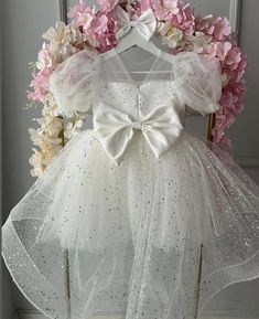 -Discover our exquisite collection of dresses for every special occasion. ✨ Our Flower Girl Dress with Train is perfect for creating magical moments 👗, while the Junior Bridesmaid Dress ensures your bridal party shines.  -🌟 Choose the Ivory Girl Dress for a timeless, elegant look 👰 or the Glitter Birthday Dress to make any celebration sparkle. 🎉 Our Baby Baptism Dress offers a touch of grace for sacred ceremonies 🙏, and the Elegant Girl Dress is ideal for any event requiring sophistication Elegant White Baptism Dress For Party, Princess Style Cream Baptism Dress For Party, Elegant Cream Princess Dress For Party, Elegant Tulle Pageant Dress For Baptism, Elegant Princess Dress With Glitter Tulle, Elegant Silver Princess Dress For Wedding, Elegant Glitter Tulle Pageant Dress, Elegant Glitter Tulle Dress For Pageants, Cream Tulle Ball Gown For Parties