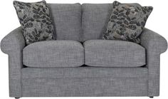 a gray couch with two pillows on it