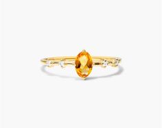 14K Yellow Gold Citrine Oval and Diamond Birthstone Ring. This ring pairs vintage style with royal elegance. Wear this classic ring and add luxury everyday and on special occassions. Classic Topaz Ring With Gemstone Accents, Classic Yellow Gold Topaz Ring With Gemstone Accents, Luxury Oval Birthstone Ring With Gemstone Accents, Elegant Yellow Birthstone Ring For Formal Occasions, Classic Citrine Birthstone Ring In Yellow Gold, Classic Formal Birthstone Ring With Gemstone Accents, Elegant Yellow Gold Topaz Ring With Gemstone Accents, Timeless Gold Oval Topaz Ring, Elegant Yellow Oval Birthstone Ring