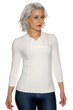 Product Details Adventure amongst the stars in style with our Space Rebel Top! Inspired by some of our favorite space adventuring heroes, rebels, and smugglers, the Space Rebel Top features a mandarin-style collar, double-breasted flap neckline, and 3/4 sleeves. Please Note: Because this is a fitted top in a white fabric, it is prone to being somewhat see-through. We recommend pairing it with a white colored undergarment if you desire. Victoria wore a thin white camisole underneath her top with Galaxy Clothing, Galaxy Outfit, Cassian Andor, Geeky Clothes, White Camisole, White Tunic Tops, Return Of The Jedi, Empire Strikes Back, Geek Fashion