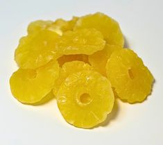 some yellow fruit is sitting on a white surface