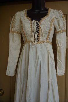 "Black label Gunne Sax prairie dress. Zips in the back and laces in the front of bust. Fits like modern XS -please see measurements. Condition is great with no flaws to note!! Measurements taken across front laid flat 16\" across front armpit to armpit 12\" across front of waist 58\" length" Fitted Bohemian Maxi Dress With Gathered Sleeves, Bohemian Fitted Maxi Dress With Gathered Sleeves, Bohemian Puff Sleeve Dress With Lace Trim, Bohemian Dresses With Lace Trim And Puff Sleeves, Vintage Dresses With Lace Trim And Puff Sleeves, Vintage Prairie Dress With Gathered Sleeves, Vintage Fitted Prairie Dress With Bishop Sleeves, Fitted Vintage Prairie Dress With Bishop Sleeves, Black Tutu Skirt